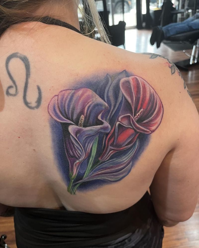Purple and red calla lilies, color realism, on a shoulder blade